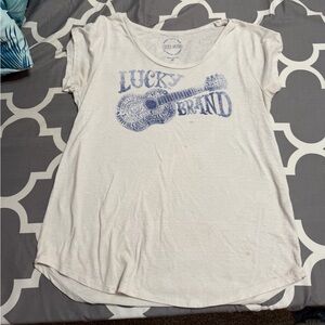 Lucky Brand Cream Tee with Blue Guitar Design